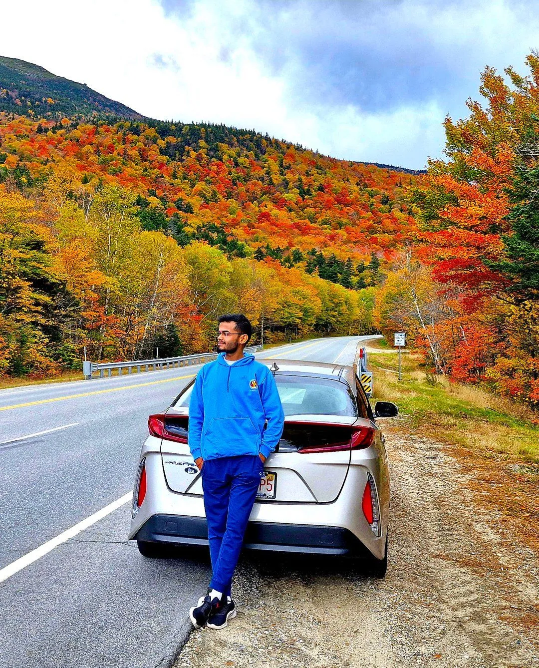 Founder sitting in front of snow capped mountain