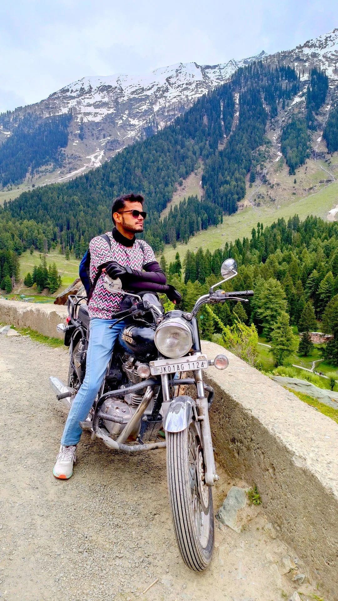 Founder standing in front of snow capped mountain
