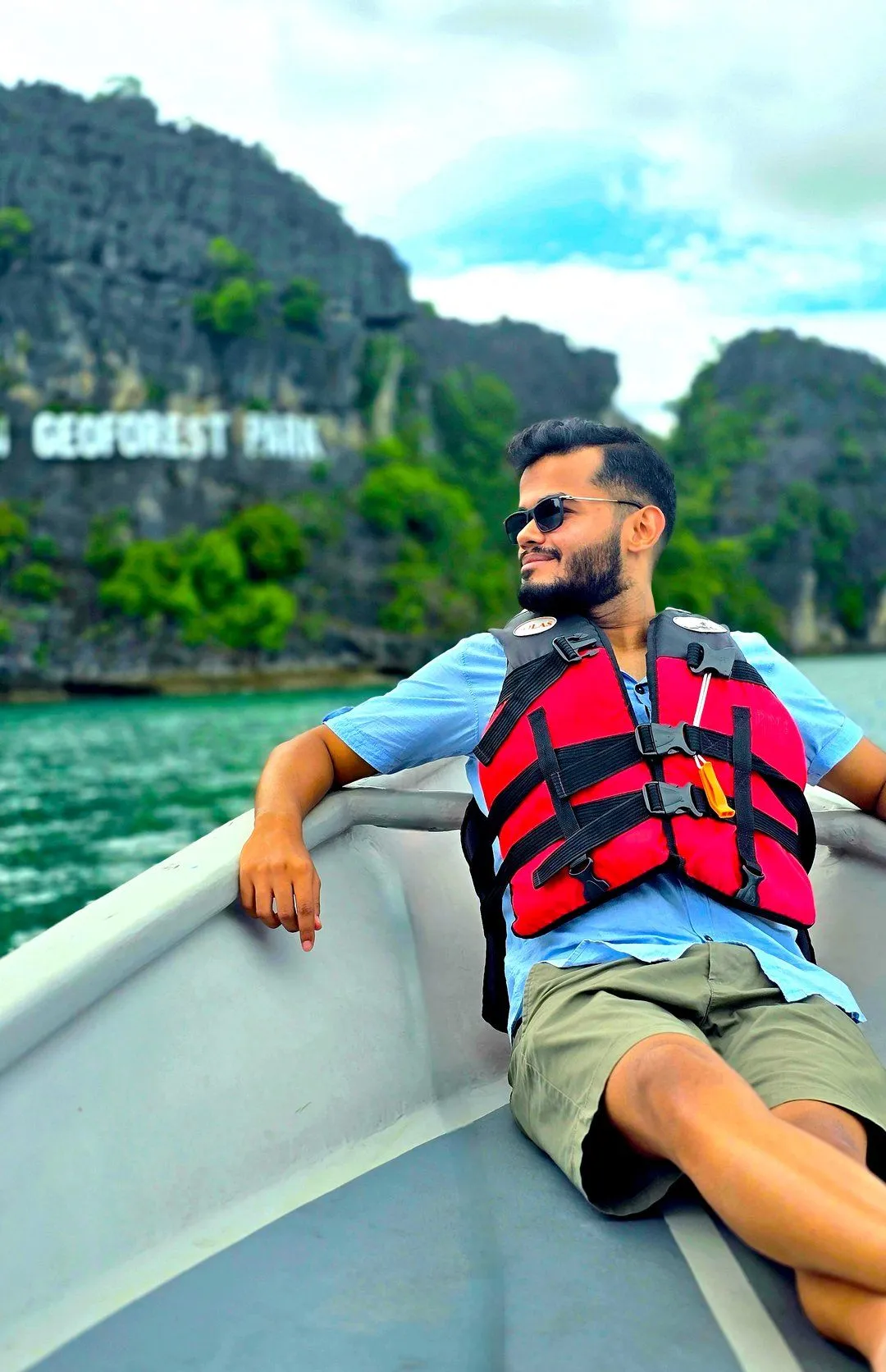 Founder standing in rocks front of a mountain